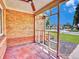 Cozy covered porch with a ceiling fan and views of the street and neighboring houses at 1600 Xanthia St, Denver, CO 80220