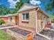 Brick home showcasing tidy yard, with side access to backyard at 1600 Xanthia St, Denver, CO 80220