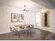 Modern dining area with a sleek wooden table and gray chairs at 99 S Downing St # B2, Denver, CO 80209