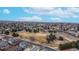 A wide aerial shot of the neighborhood with ball park and open space at 12861 Royal Ct, Broomfield, CO 80020