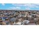 A drone shot of a neighborhood with lots of homes and mature trees surrounding the area at 12861 Royal Ct, Broomfield, CO 80020