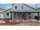 Exterior of house with large covered patio and hot tub at 12861 Royal Ct, Broomfield, CO 80020