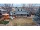 An aerial view of the backyard featuring a playground, patio and lush green lawn at 12861 Royal Ct, Broomfield, CO 80020