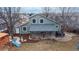 An aerial view of the backyard showcasing a covered patio and a small playground at 12861 Royal Ct, Broomfield, CO 80020