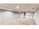 Unfinished basement with neutral paint color, carpet, and built-in shelving units at 12861 Royal Ct, Broomfield, CO 80020