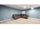 Finished basement with recessed lighting, plush carpet, and a leather sectional at 12861 Royal Ct, Broomfield, CO 80020