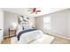 Bedroom featuring a queen-size bed, soft rug, neutral walls, and a modern ceiling fan at 12861 Royal Ct, Broomfield, CO 80020