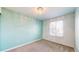 Cozy bedroom with a ceiling light fixture and window at 12861 Royal Ct, Broomfield, CO 80020