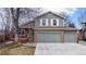 Charming two-story home featuring a three-car garage and a welcoming front porch at 12861 Royal Ct, Broomfield, CO 80020