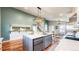 Spacious kitchen featuring a large island, hardwood floors and stainless-steel appliances at 12861 Royal Ct, Broomfield, CO 80020