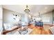 Stylish living area featuring hardwood floors, modern lighting, and an adjacent gourmet kitchen at 12861 Royal Ct, Broomfield, CO 80020