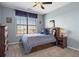 Charming bedroom with built-in storage, a neutral color scheme, and a ceiling fan for added comfort at 6299 Ellingwood Point Pl, Castle Rock, CO 80108