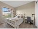 Cozy bedroom with a serene ambiance, featuring a comfortable bed and a peaceful view from the window at 6299 Ellingwood Point Pl, Castle Rock, CO 80108