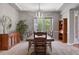 Spacious dining room with a large table, perfect for gatherings, complemented by stylish decor at 6299 Ellingwood Point Pl, Castle Rock, CO 80108