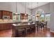 Gourmet kitchen featuring a spacious island, stainless steel appliances, and a bright breakfast nook at 6299 Ellingwood Point Pl, Castle Rock, CO 80108