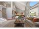 Bright and airy living space that connects the kitchen and second floor, perfect for entertaining at 6299 Ellingwood Point Pl, Castle Rock, CO 80108