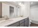 Bright bathroom features dual sinks with a white countertop, gray cabinets, and recessed lighting at 2512 Lupton Ln, Lafayette, CO 80026