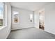 Bright bedroom with carpet and natural light from multiple windows at 2512 Lupton Ln, Lafayette, CO 80026
