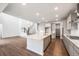 Open concept kitchen with a large island, stainless steel appliances, and modern finishes at 2512 Lupton Ln, Lafayette, CO 80026