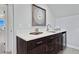 Home wet bar with stainless steel sink, beverage cooler, stylish fixtures, and art at 359 Josef Cir, Fort Lupton, CO 80621