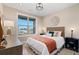 Bright bedroom with natural light, neutral decor, and a comfortable queen-size bed at 359 Josef Cir, Fort Lupton, CO 80621