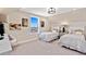 Bright bedroom featuring twin beds, neutral walls, artwork, and a large window at 359 Josef Cir, Fort Lupton, CO 80621