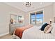 Cozy bedroom with large window, modern decor, and a comfortable queen-size bed at 359 Josef Cir, Fort Lupton, CO 80621