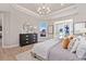 Bright bedroom with wood floors, tray ceiling, and large window with a great view at 359 Josef Cir, Fort Lupton, CO 80621