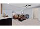 Cozy bonus room features a wet bar, comfortable seating, and a modern ceiling fan at 359 Josef Cir, Fort Lupton, CO 80621