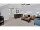 Entertaining bonus room with wet bar, leather couch and an accent chair at 359 Josef Cir, Fort Lupton, CO 80621