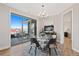 Dining room with sliding glass doors to deck, neutral paint and a modern chandelier at 359 Josef Cir, Fort Lupton, CO 80621