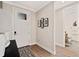 Bright entryway featuring hardwood floors, a decorative rug, and modern decor at 359 Josef Cir, Fort Lupton, CO 80621