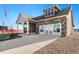 Beautiful single-Gathering home featuring stone accents, a covered porch, and a spacious driveway at 359 Josef Cir, Fort Lupton, CO 80621