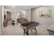 Finished basement with a recreational area, carpeted floors, and neutral paint at 6480 Moss Cir, Arvada, CO 80007