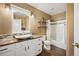 Bathroom featuring tile floors, decorative lighting and granite countertop at 6480 Moss Cir, Arvada, CO 80007