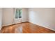 Bedroom featuring hardwood floors and neutral walls at 6480 Moss Cir, Arvada, CO 80007