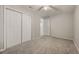 Bedroom with carpet, ceiling fan, closet, and neutral paint at 6480 Moss Cir, Arvada, CO 80007