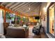 Entertainers dream - a spacious covered patio with a kitchen, fire pit, and comfortable seating at 6480 Moss Cir, Arvada, CO 80007