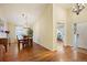 Cozy dining room with hardwood floors, chandelier, and natural light at 6480 Moss Cir, Arvada, CO 80007