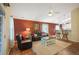 Bright living room featuring an open floor plan, hardwood floors, and ample natural light, perfect for comfortable living and entertaining at 6480 Moss Cir, Arvada, CO 80007
