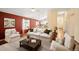 Comfortable living room showcases vaulted ceilings, modern furnishings, and hardwood flooring at 6480 Moss Cir, Arvada, CO 80007