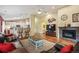 Cozy living room with a fireplace, hardwood floors, and an open layout, perfect for relaxing with friends and Gathering at 6480 Moss Cir, Arvada, CO 80007