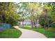 Scenic walking path winds through the community's lush green spaces and landscaping at 6480 Moss Cir, Arvada, CO 80007