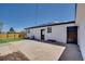 Backyard featuring a concrete patio and white home at 7826 Joan Dr, Denver, CO 80221