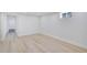 Basement room with hardwood floors, recessed lighting, and window at 7826 Joan Dr, Denver, CO 80221