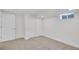 Finished basement bedroom features carpet, a closet, and a window at 7826 Joan Dr, Denver, CO 80221