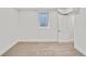 Finished basement bedroom features carpet and a window at 7826 Joan Dr, Denver, CO 80221