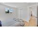 Bedroom with hardwood floors, closet, and a window for ample natural light at 7826 Joan Dr, Denver, CO 80221