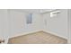 Finished basement bedroom features carpet and a window at 7826 Joan Dr, Denver, CO 80221