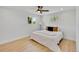 Bright bedroom with hardwood floors, ceiling fan, and two windows for ample natural light at 7826 Joan Dr, Denver, CO 80221